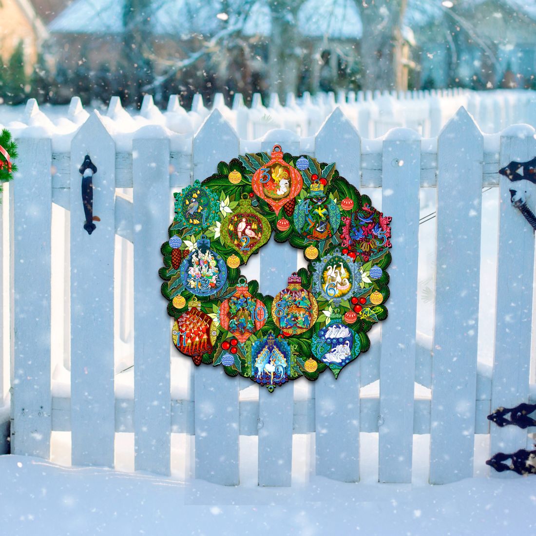 12 Days of Christmas door wreath with bright numbered ornaments against a white fence