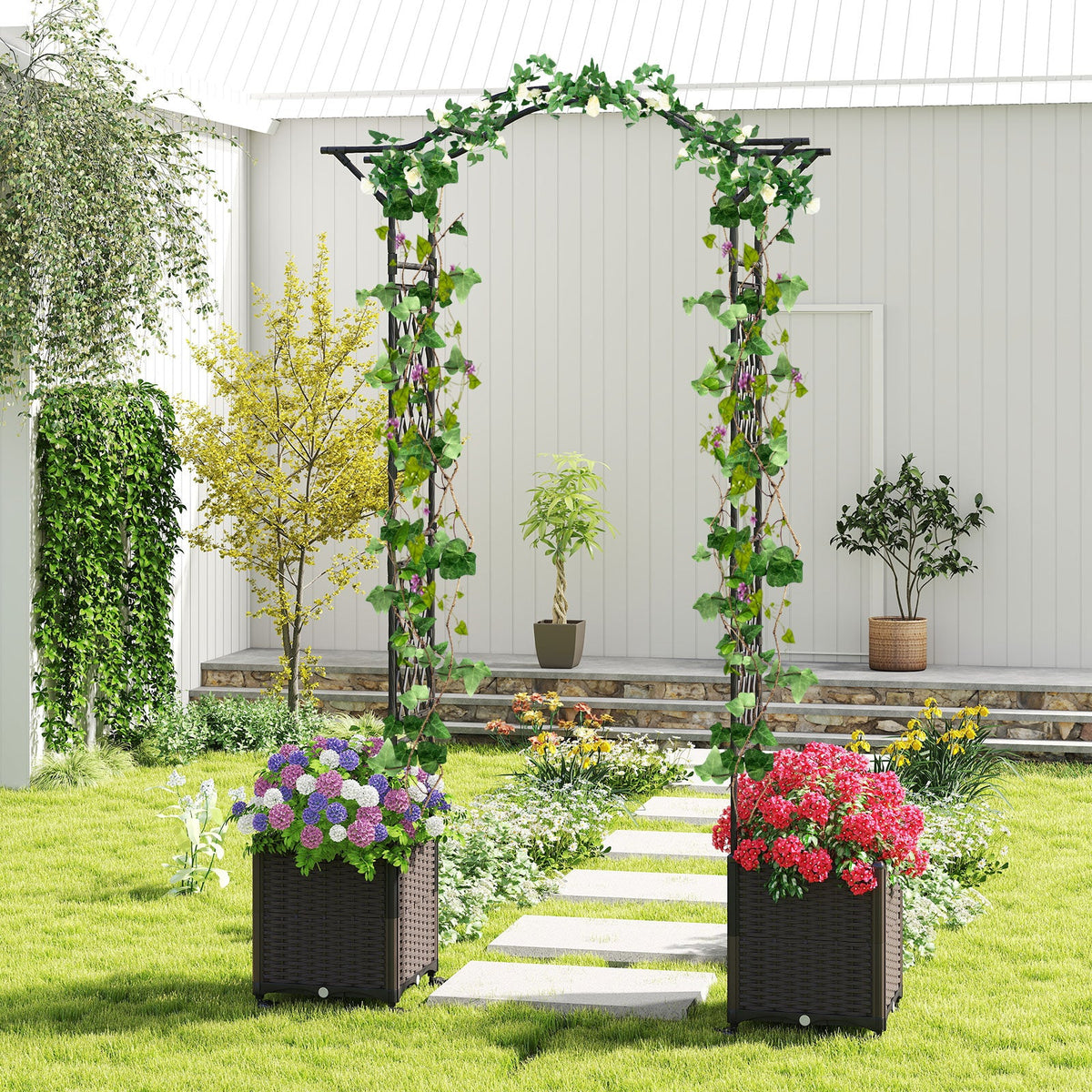 Black garden arch trellis with leafy vines and two wheeled planter boxes outdoors