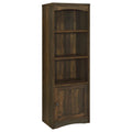 Dark pine media storage tower with arched top open shelves and lower cabinet door