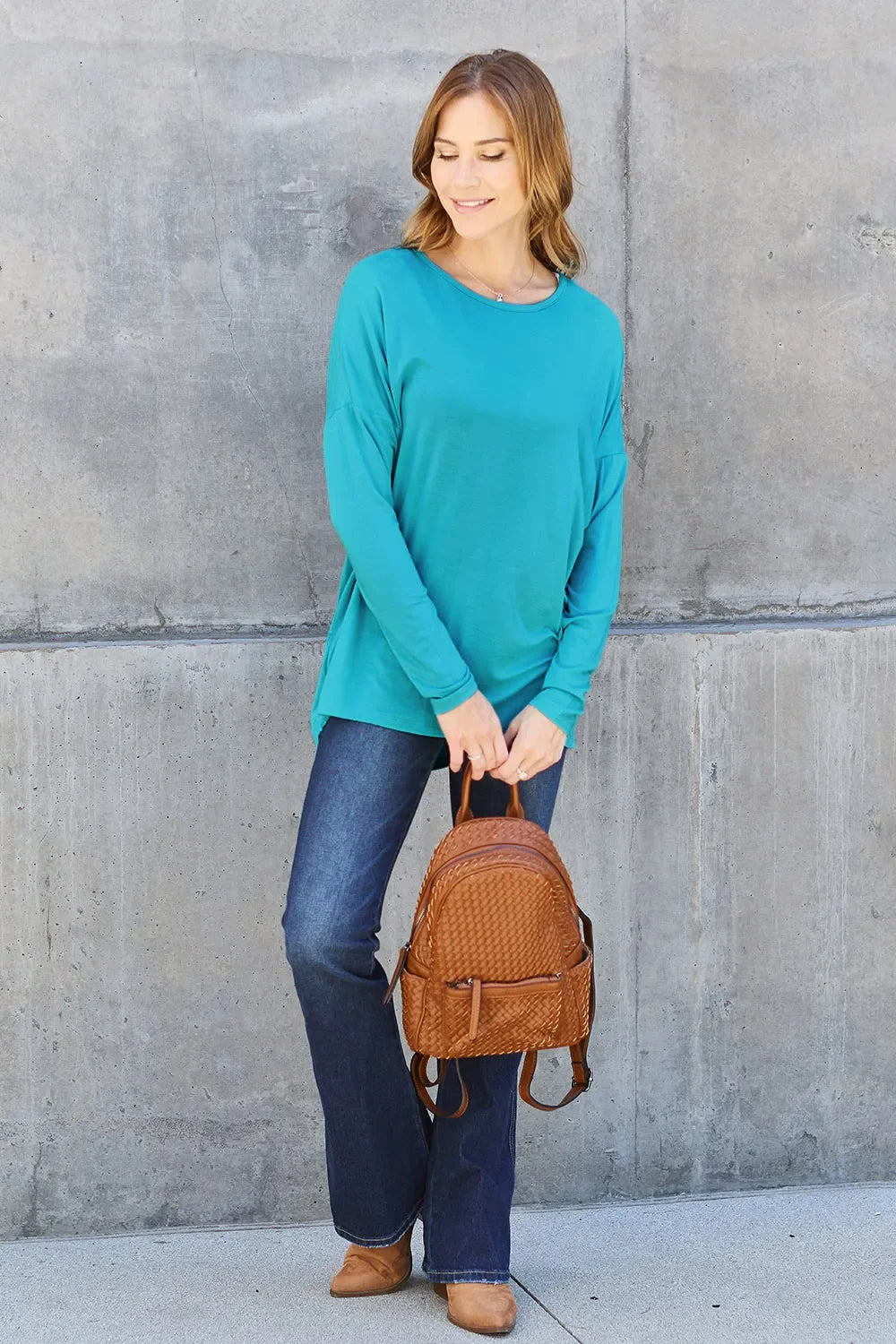 Sky blue relaxed long-sleeve tee, side view with crew neck and straight hem