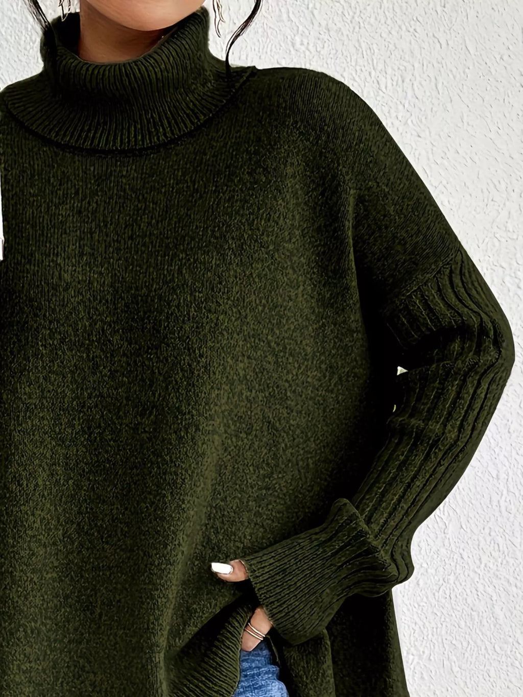 Dark green turtleneck high-low hem sweater with ribbed cuffs and folded collar