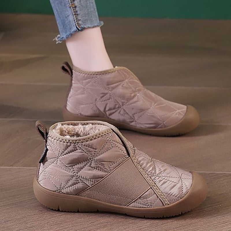 Quilted taupe ankle snow boots with fleece lining, side zip, and flat tread sole