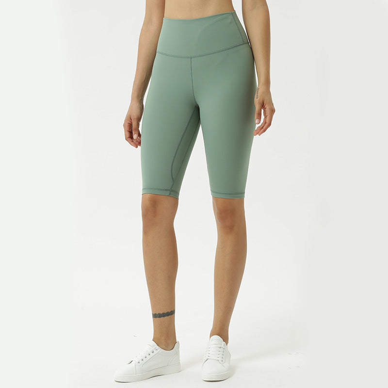 High-waist forest green yoga capri pants, tapered fit