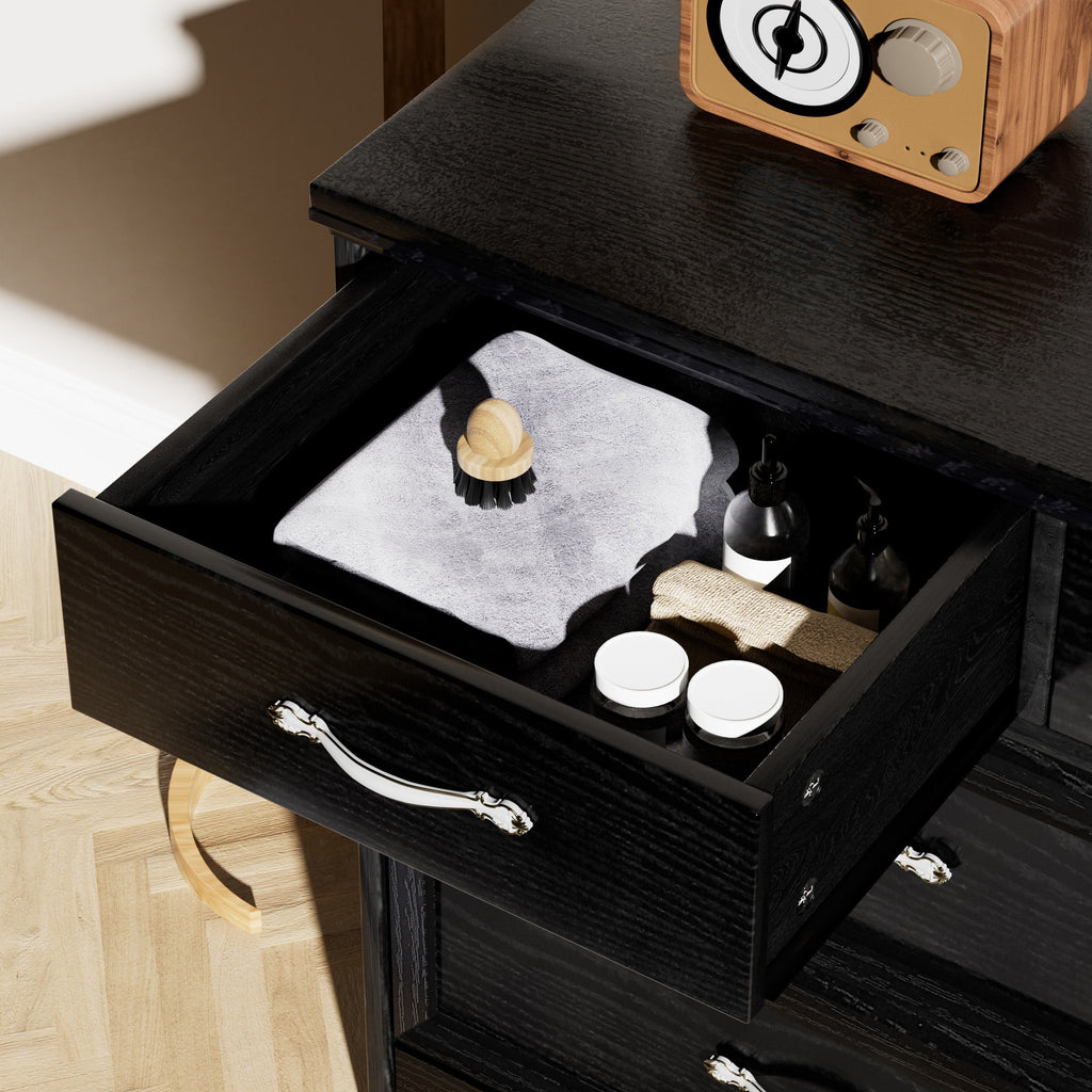 Black dresser chest with open drawer showing compartments and chrome metal pull handle