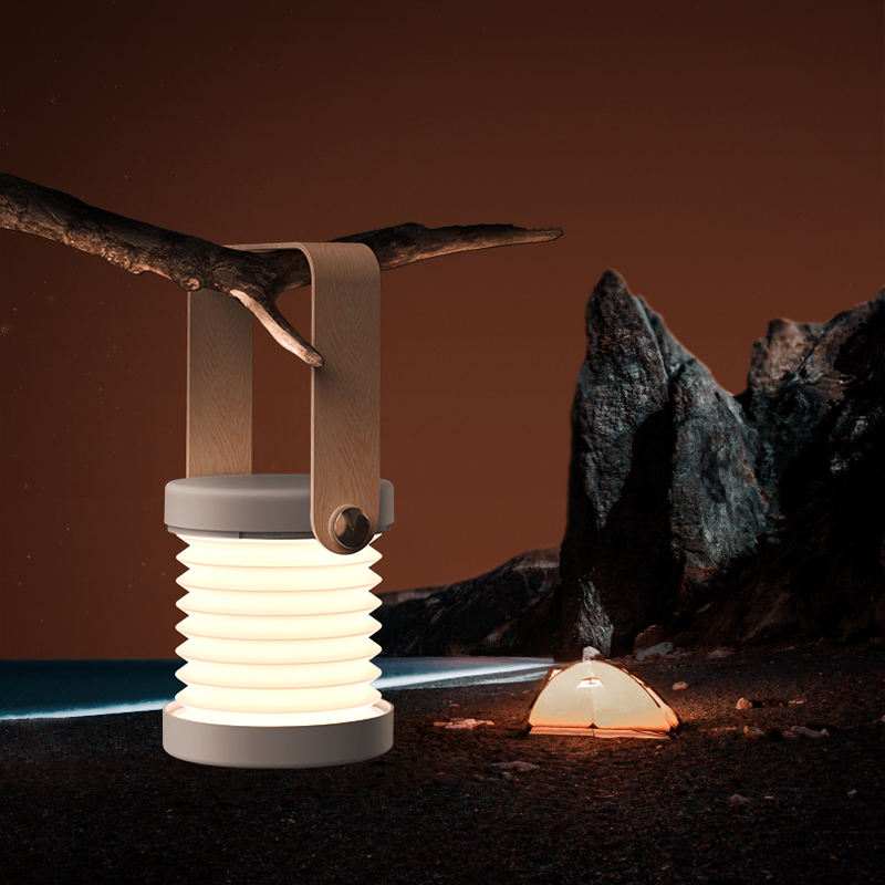 Foldable LED reading lantern light with white ribbed shade and warm glow