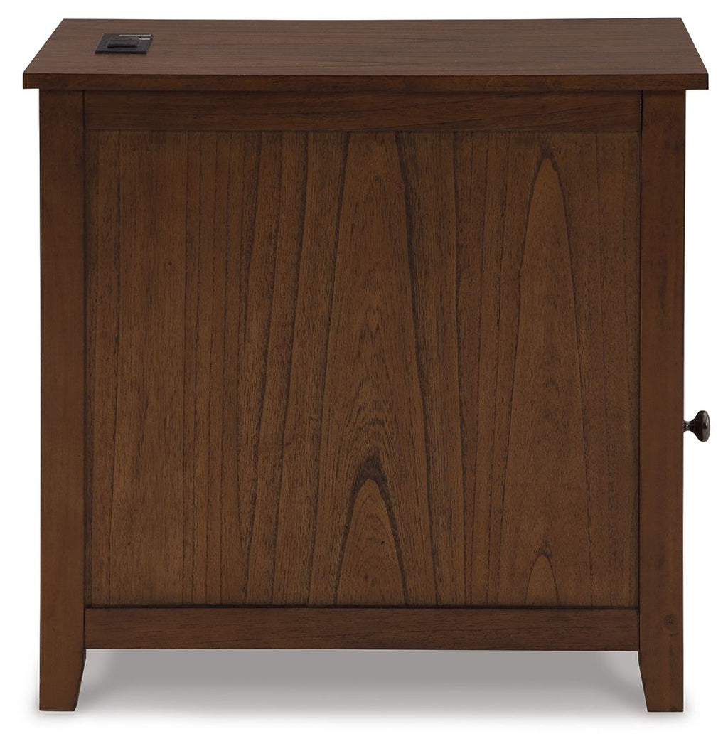 Dark brown chairside end table with cabinet door and top drawer with metal pull