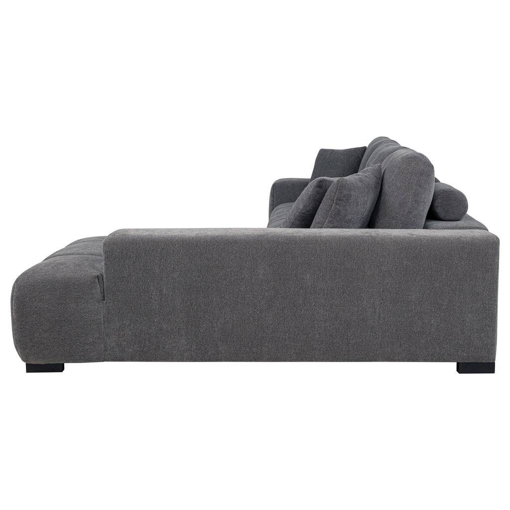 Charcoal gray sectional chaise sofa close view of chaise armrest and back pillows