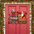 Colorful Santa train door decoration with snowman in a smokestack and toy wheels
