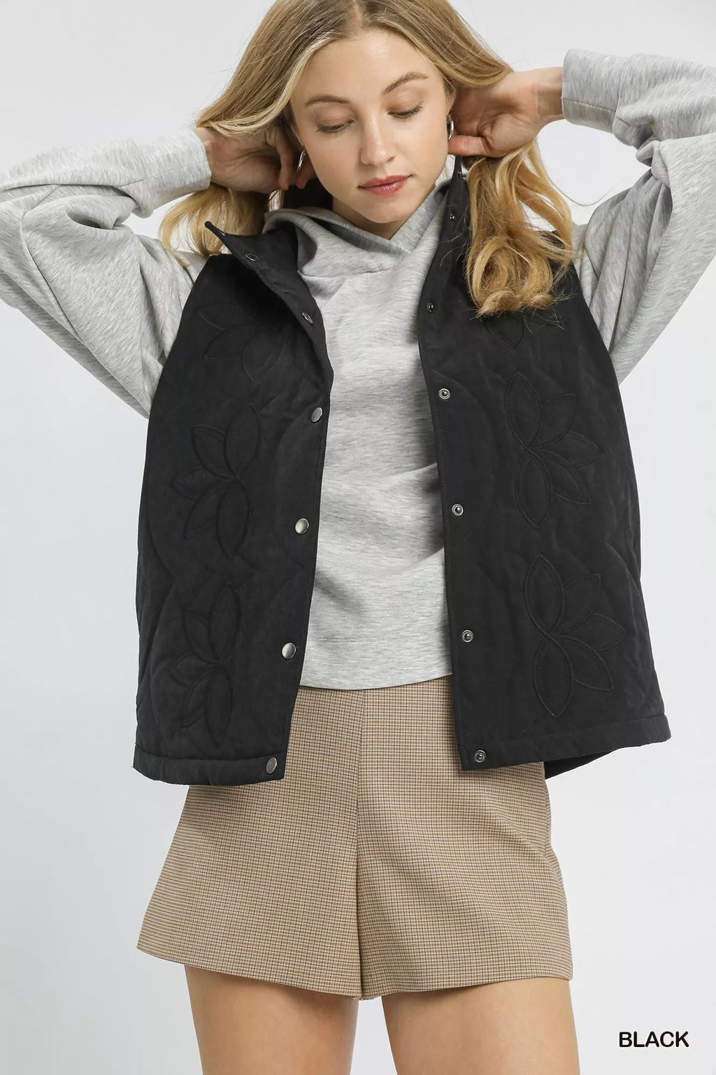 Black quilted embroidered vest with button front and stand collar