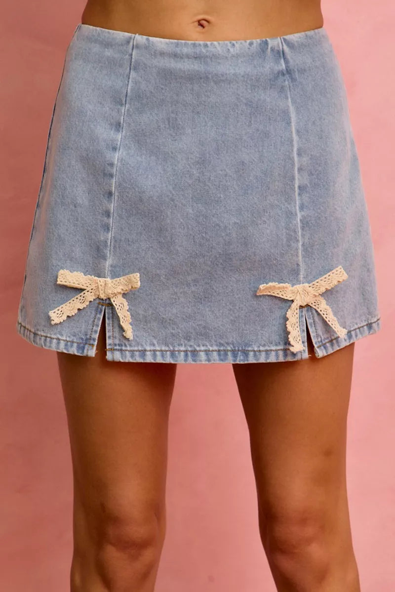 Denim mini skirt with lace ribbon bow ties at front hem