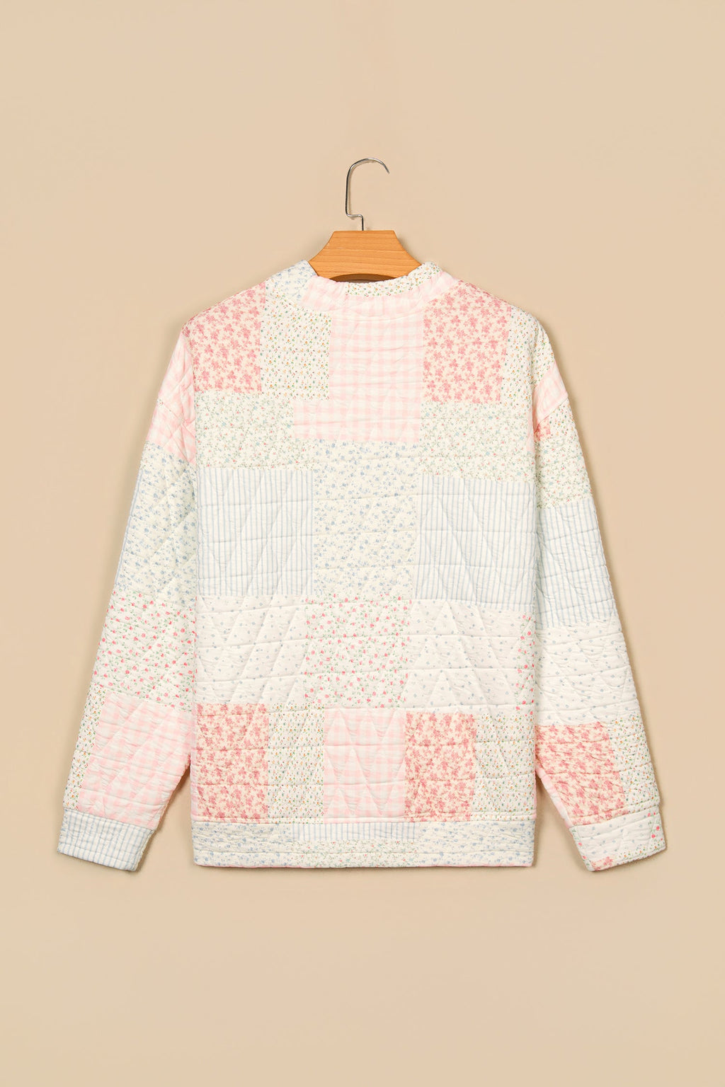 Floral patchwork quilted mock neck long sleeve top, multicolour, back view on hanger