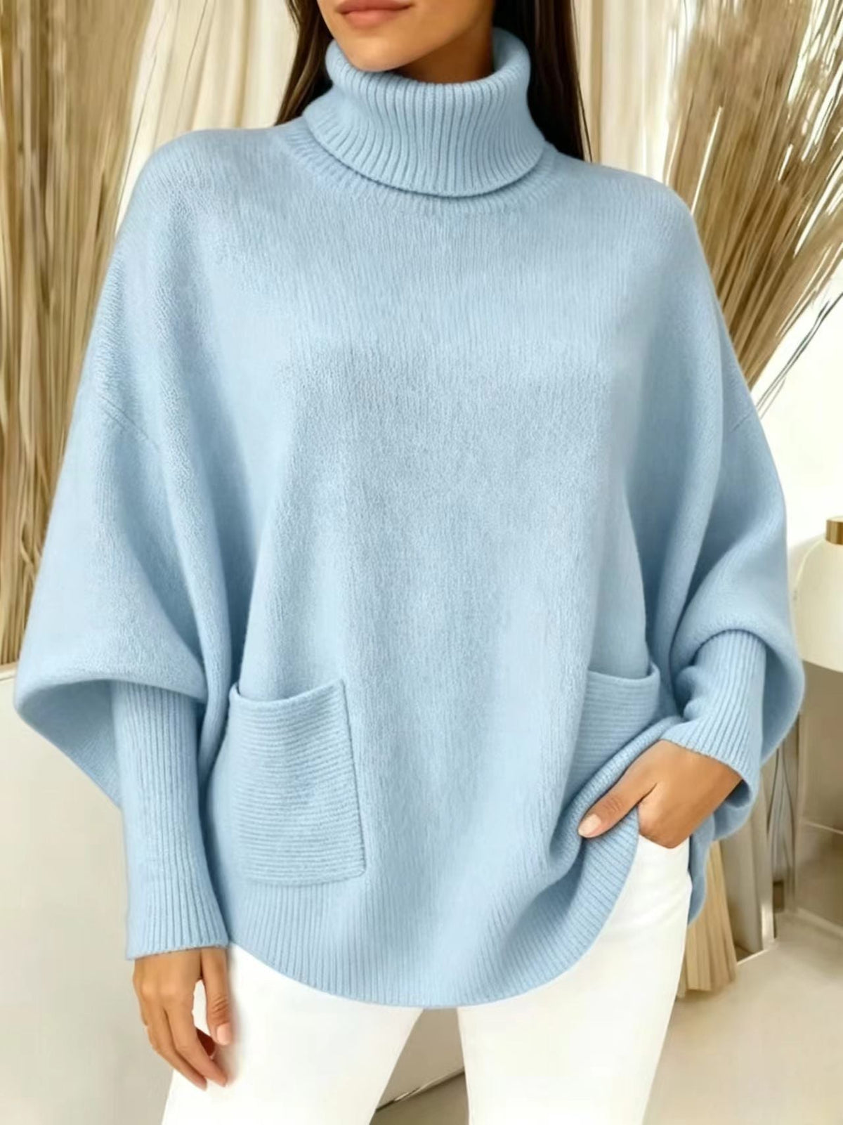 Pastel light-blue turtleneck sweater with long sleeves and front patch pocket