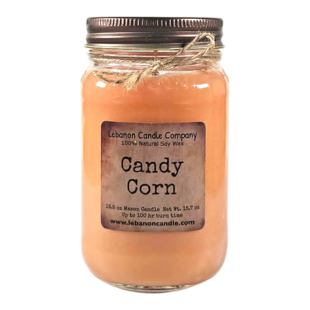 Candy corn scented soy candle in clear glass mason jar, peach wax, metal lid