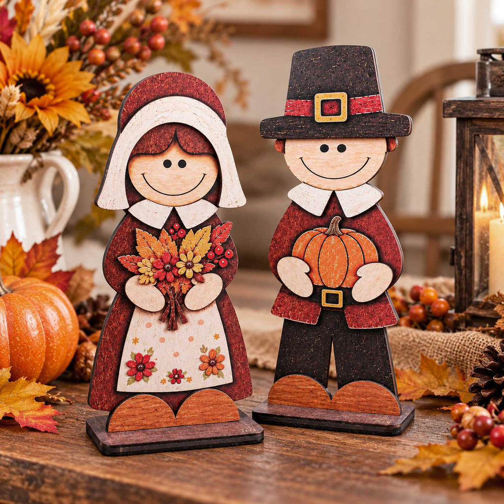 Handcrafted wooden pilgrim couple tabletop decorations with pumpkin and flower bouquet accents
