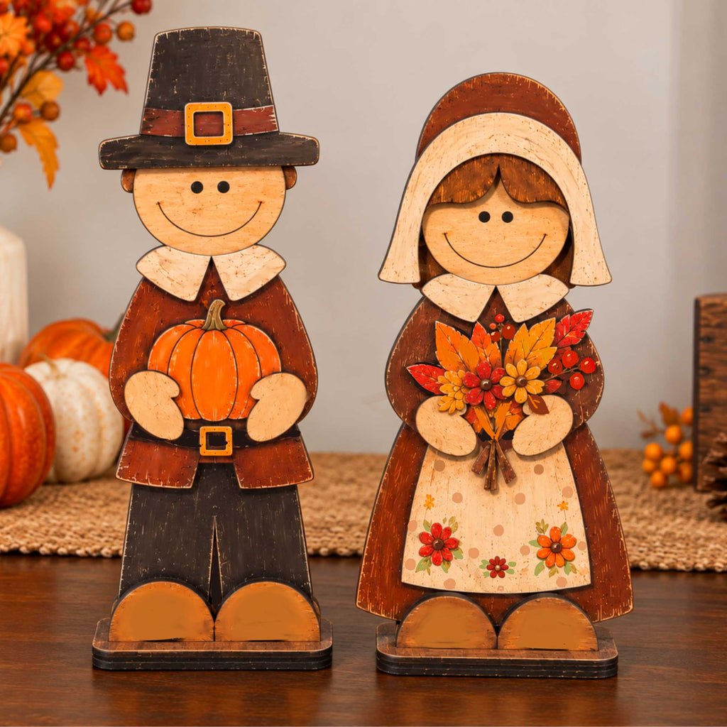 Wooden pilgrim couple tabletop decorations with pumpkin, floral bouquet, and coordinated hats