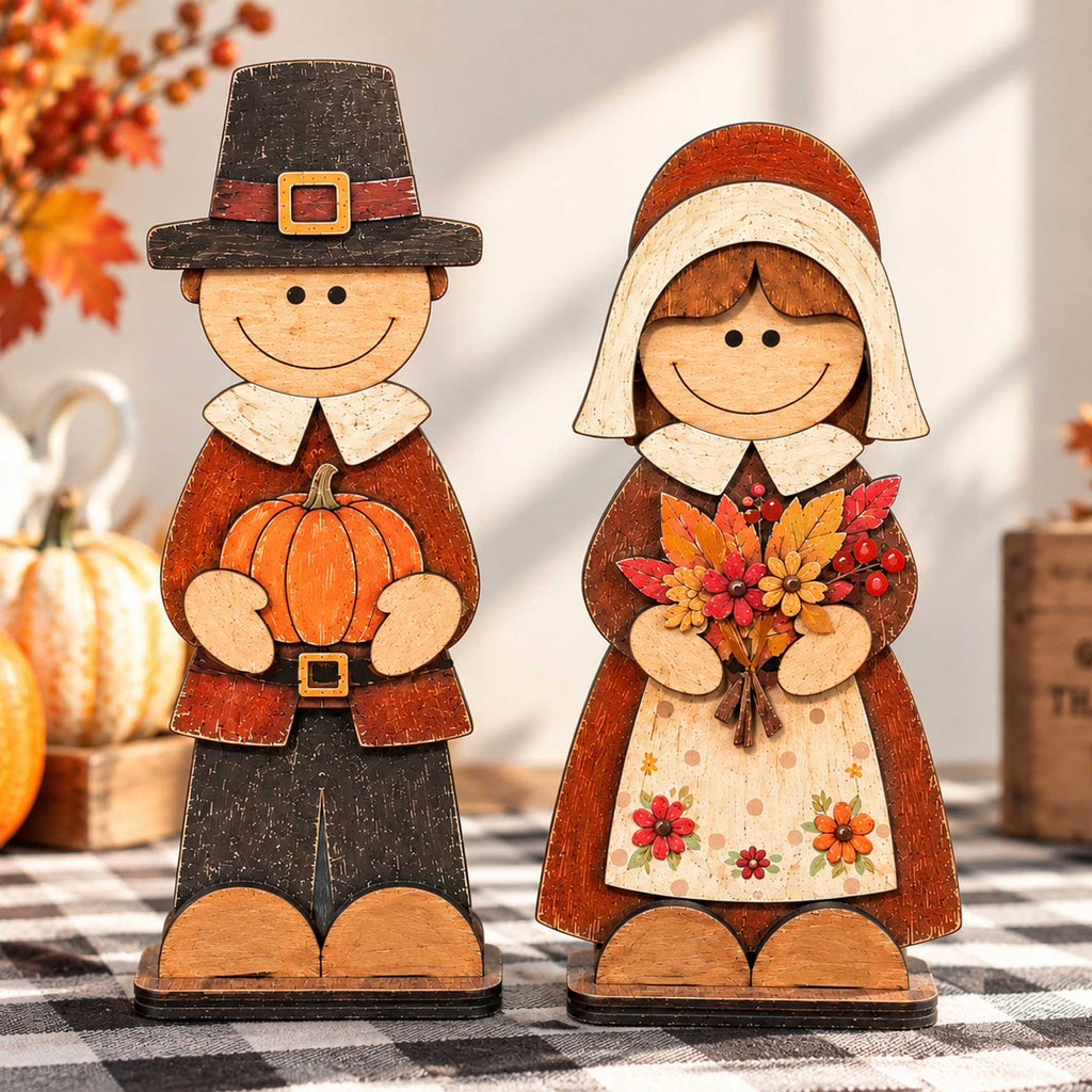 Handcrafted wooden pilgrim couple tabletop decorations with pumpkin and fall floral bouquet