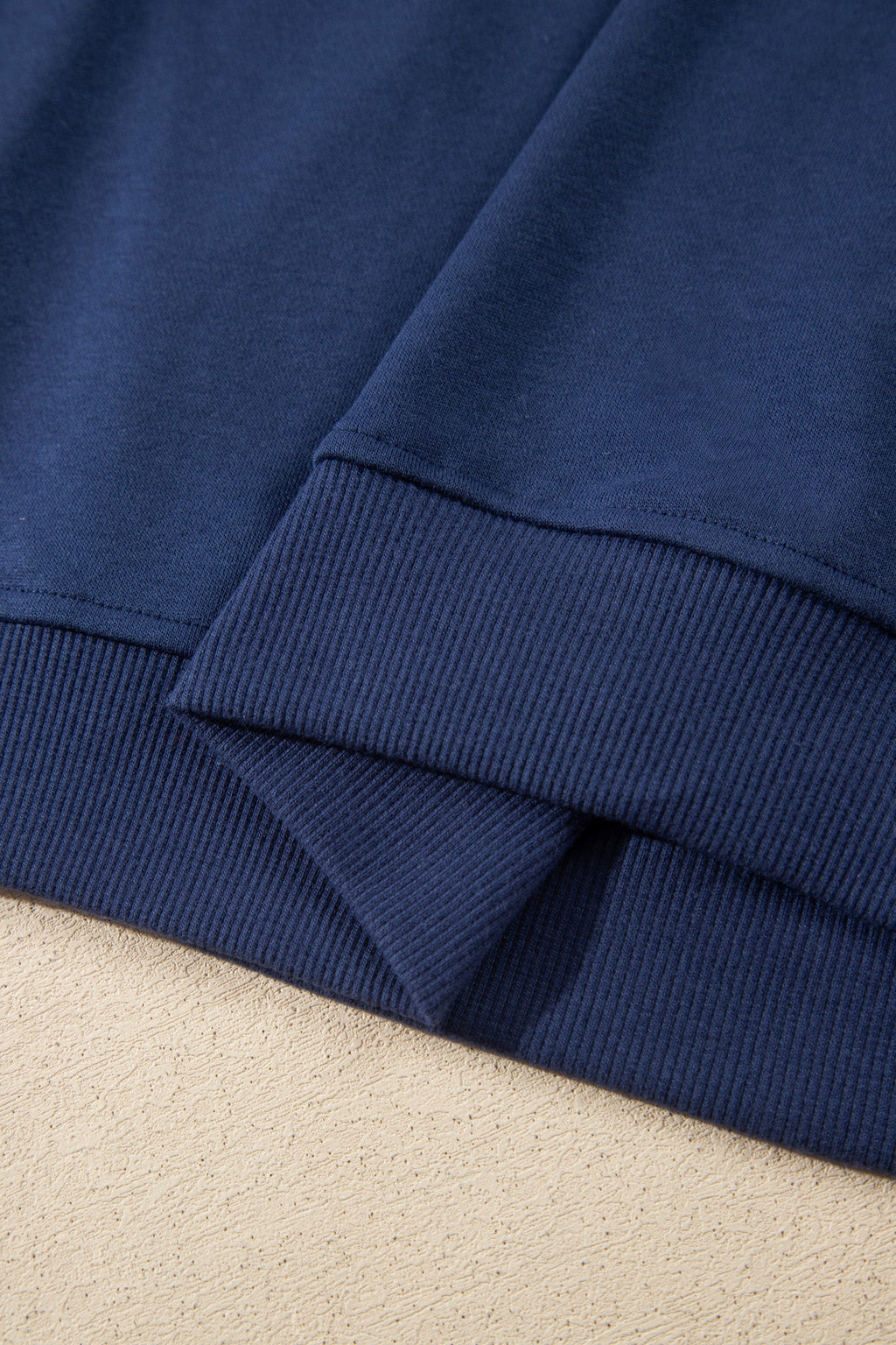 Navy skort hem with ribbed cuff trim at waistband and tie feature