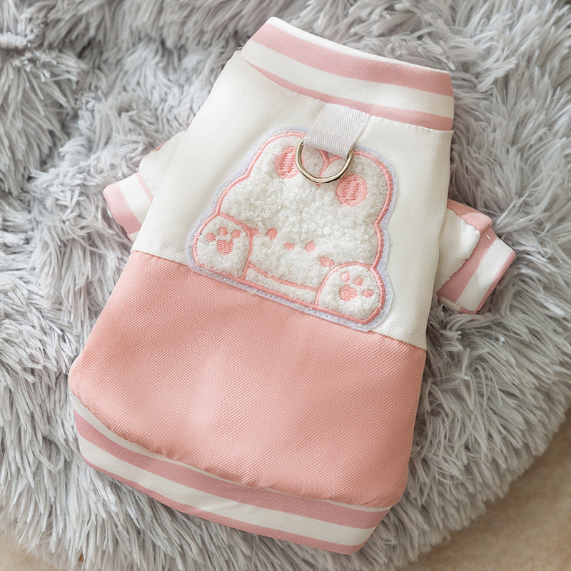 Pink and white padded dog jacket with bear patch and leash ring