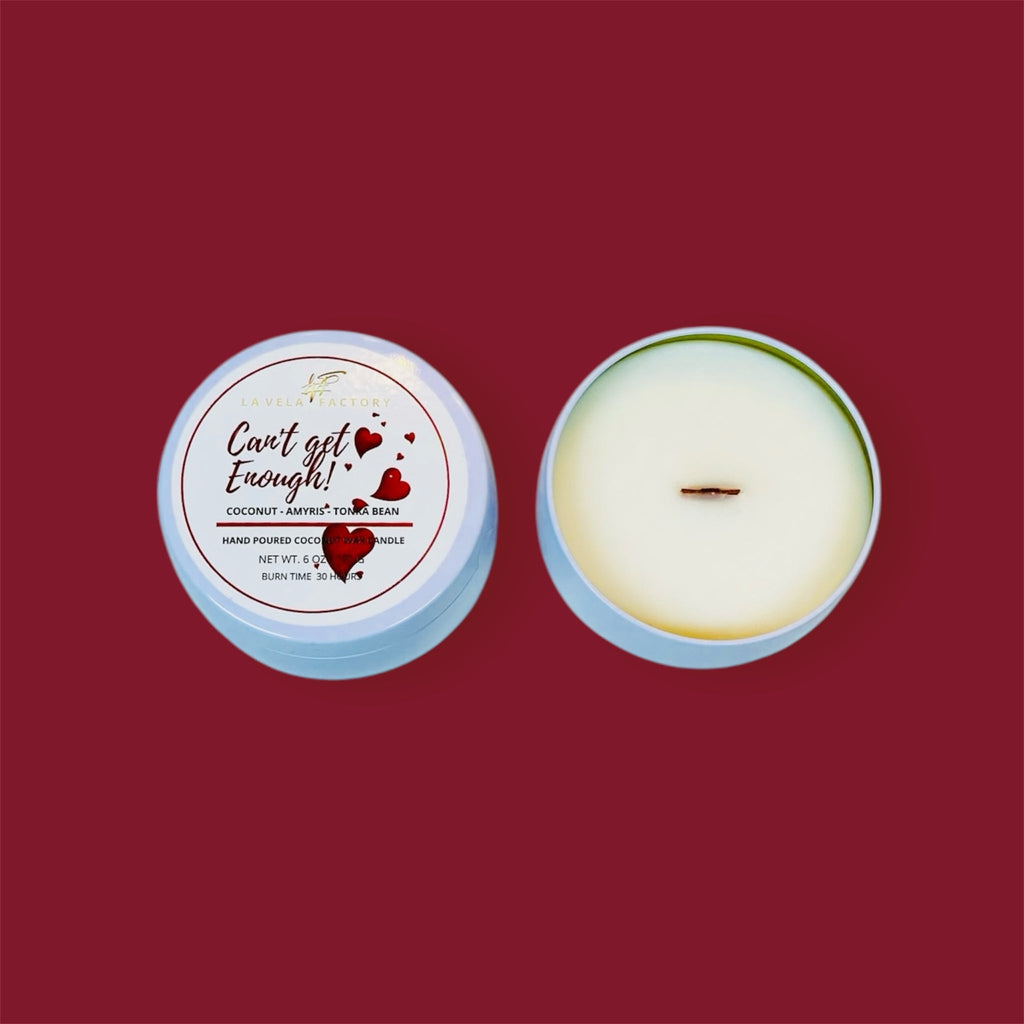Cream wax wood wick candle labeled Can't Get Enough in round tin