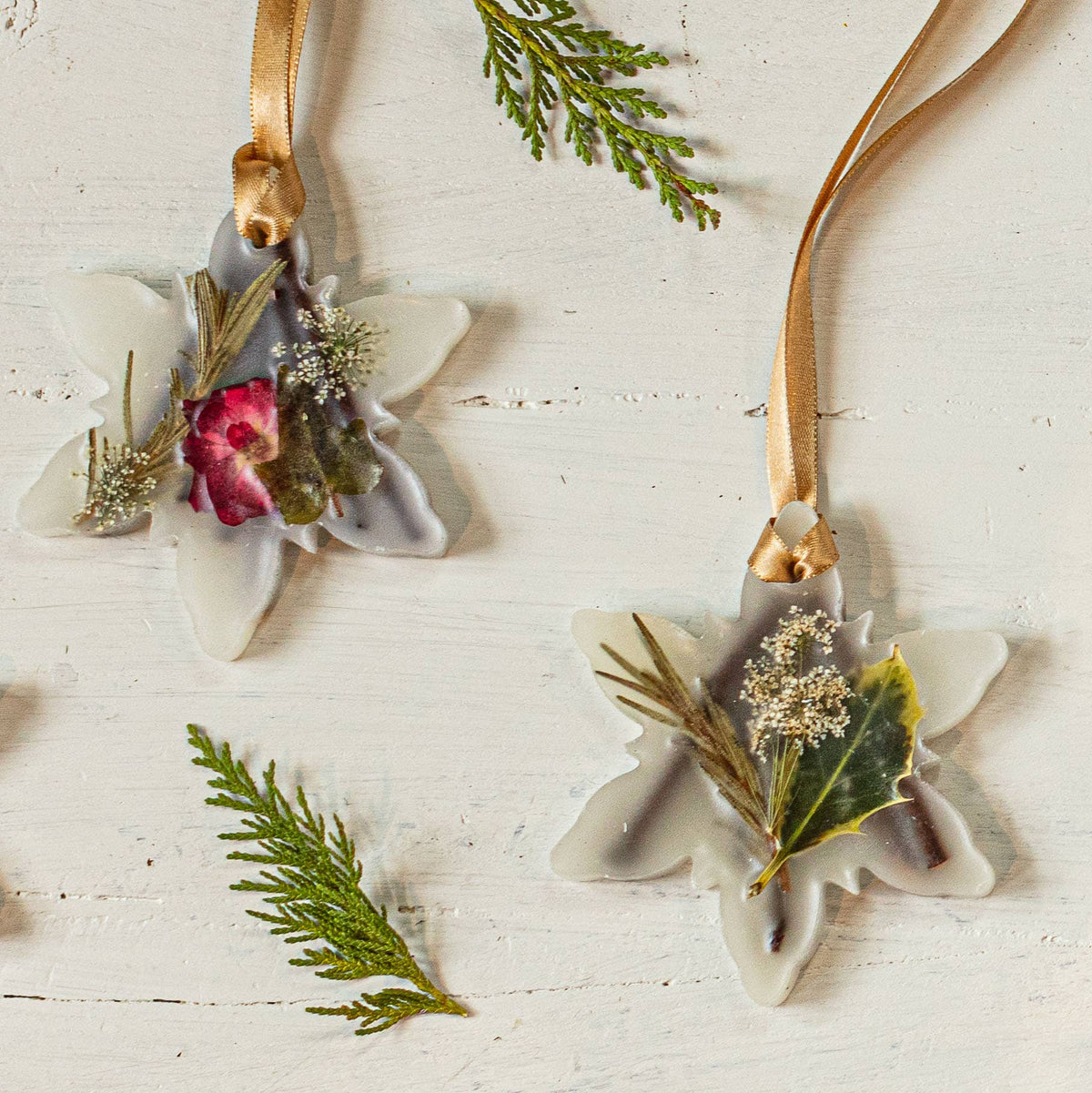 Botanical sachet floral ornaments with ribbon ties, white flowers with dried greenery and one pink bud