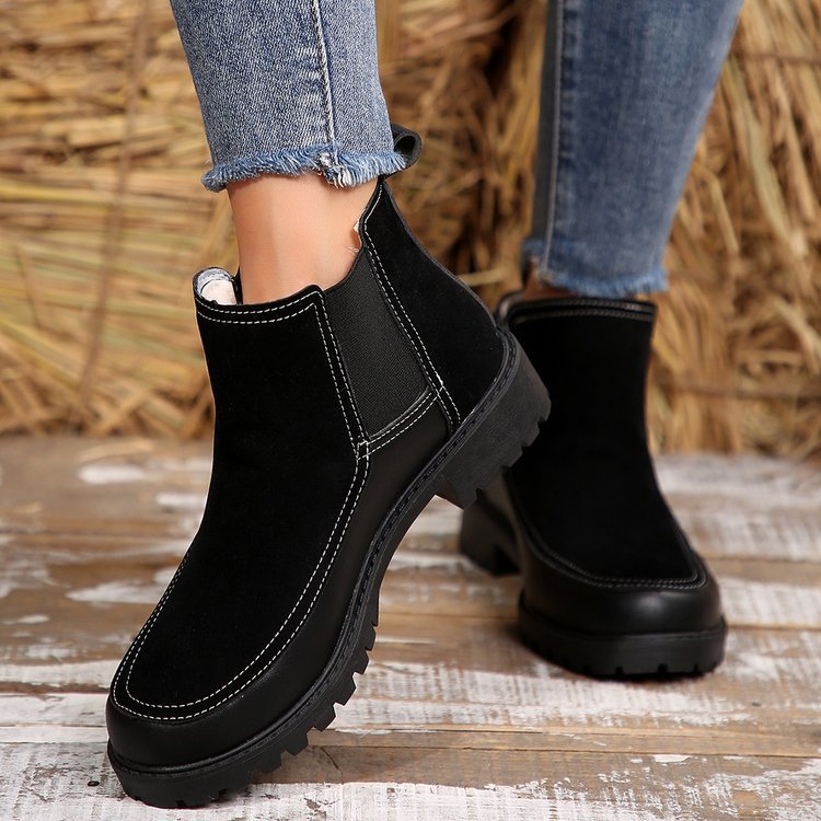 Black platform ankle boots, pull-on style with side panel and stitched detailing
