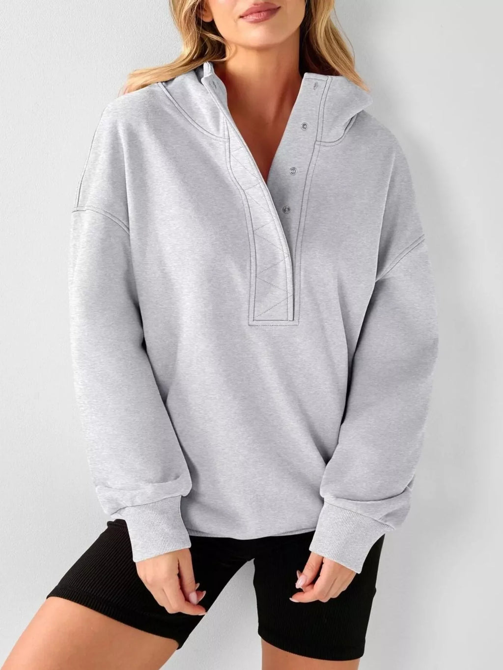 Light gray half-snap pullover hoodie with hood detail and kangaroo pocket