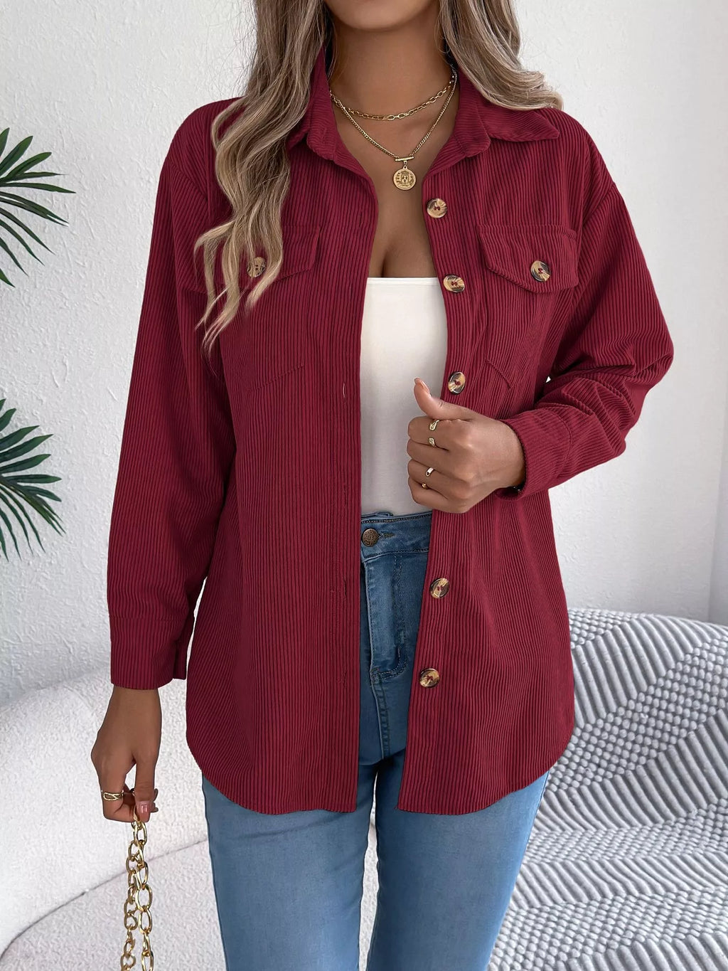 Wine red corduroy shacket with pointed collar, button placket, and flap chest pockets