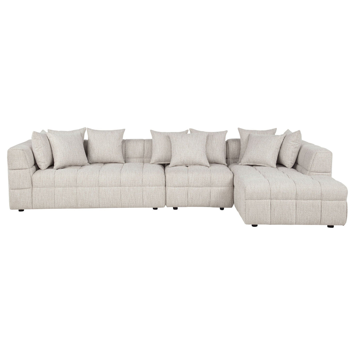 Light beige sectional sofa with chaise and three seat sections, square arms