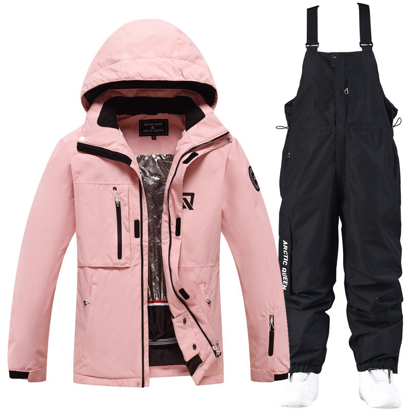 Pink hooded ski jacket with black snow pants set, black trim and adjustable straps
