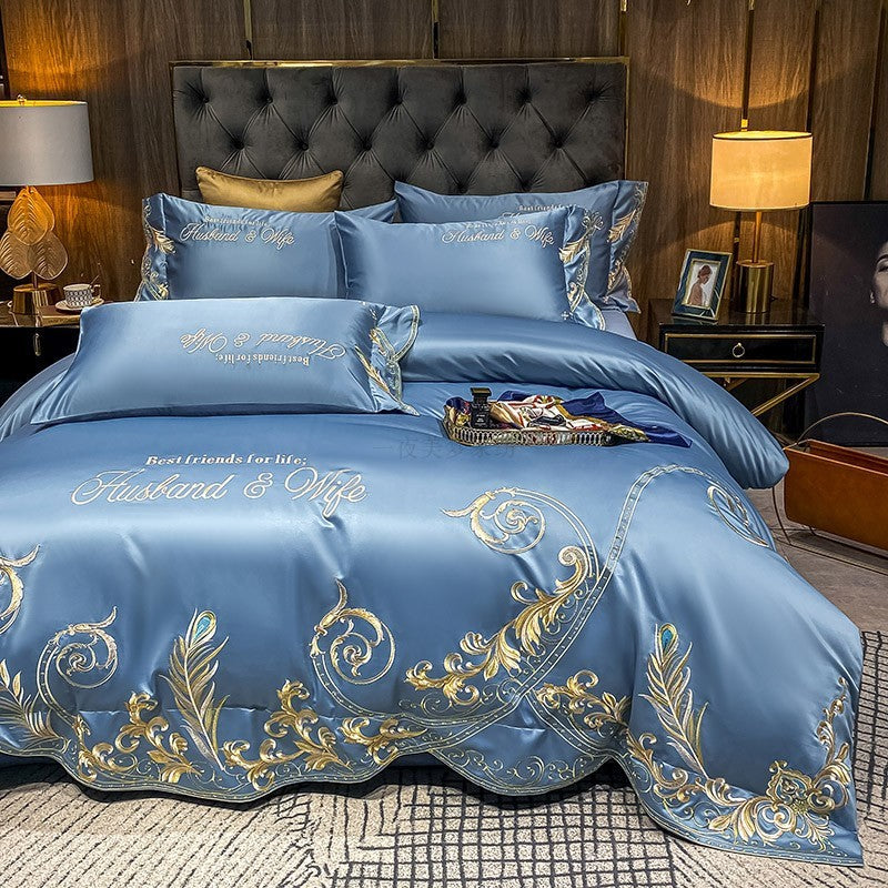 Blue quilted bed sheet set with gold baroque embroidery and matching pillowcases