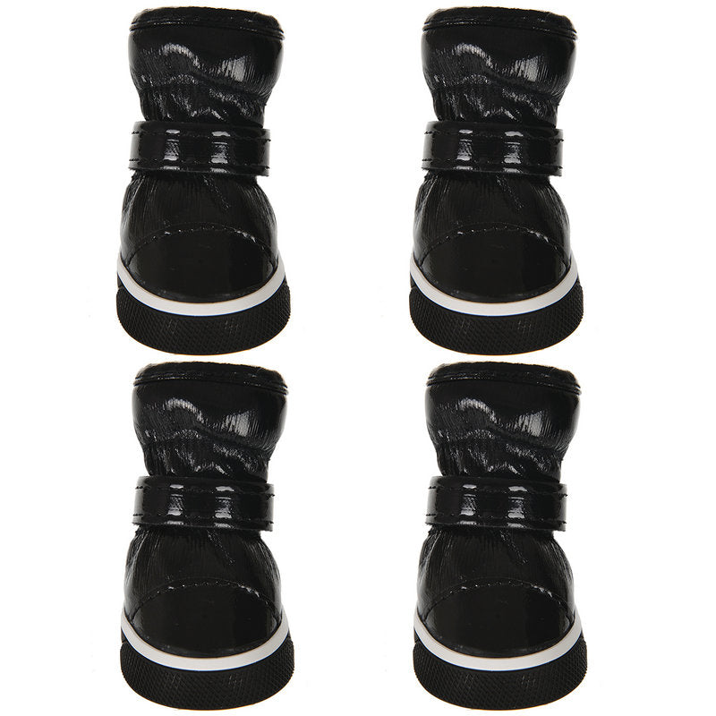 Black pet ski boots shown from multiple angles, with white-trim rubber soles and hook straps