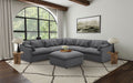 Charcoal modular sectional sofa with tufted back cushions and armrests
