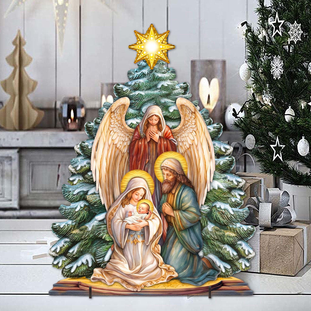 Nativity yard decor with glowing star, angel wings, Mary holding baby, and Joseph in front