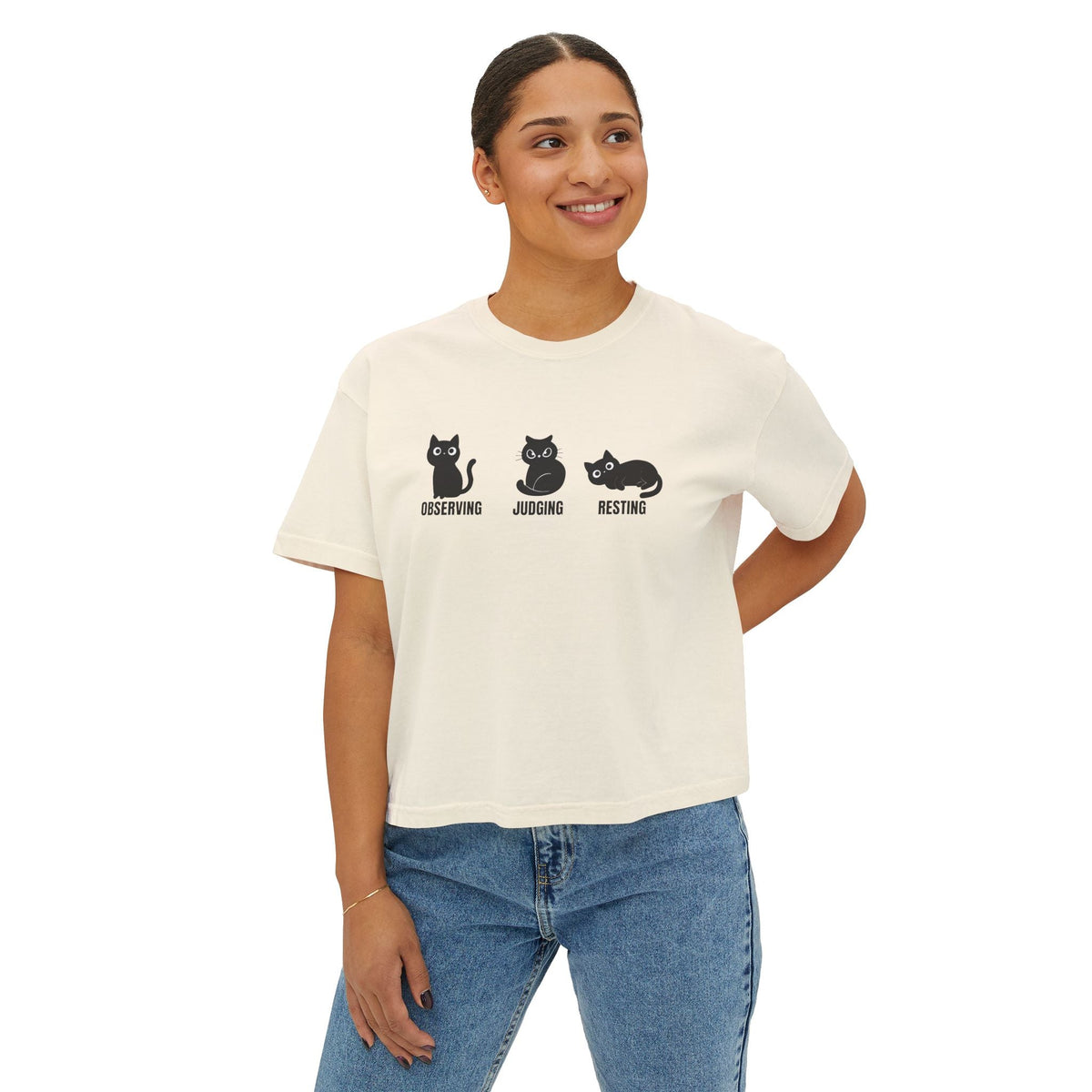 Boxy cropped cat tee in ivory with black cat trio graphic and text on the front