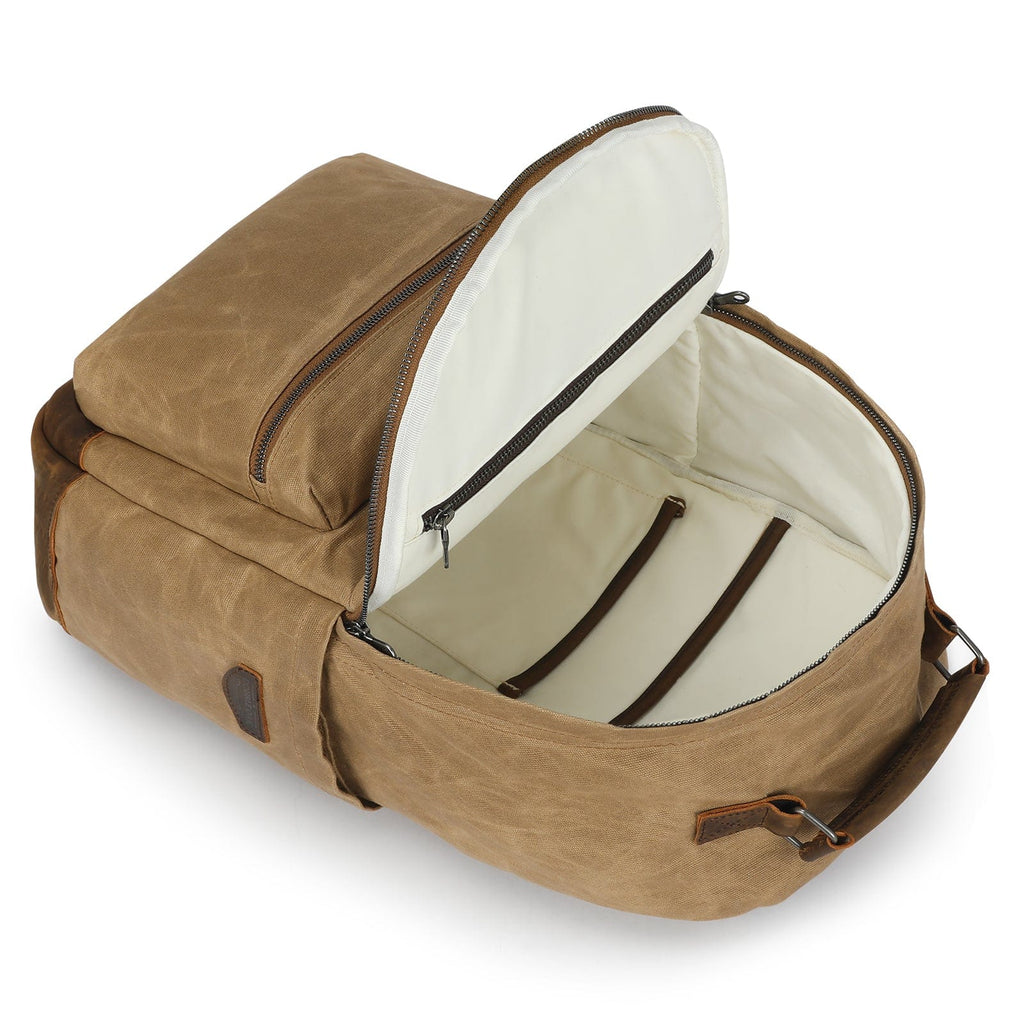 Tan backpack with open top showing light interior and inner strap pockets