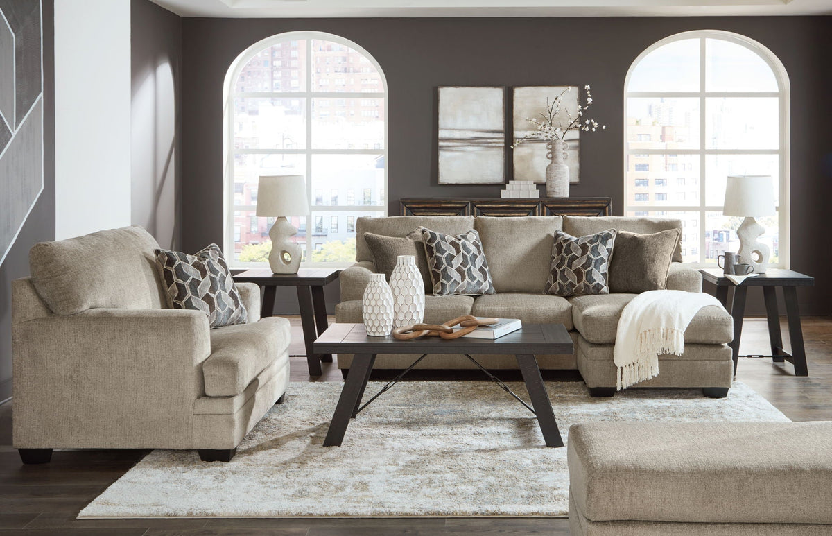 Light brown fabric living room set with sofa, loveseat, armchairs, and ottoman
