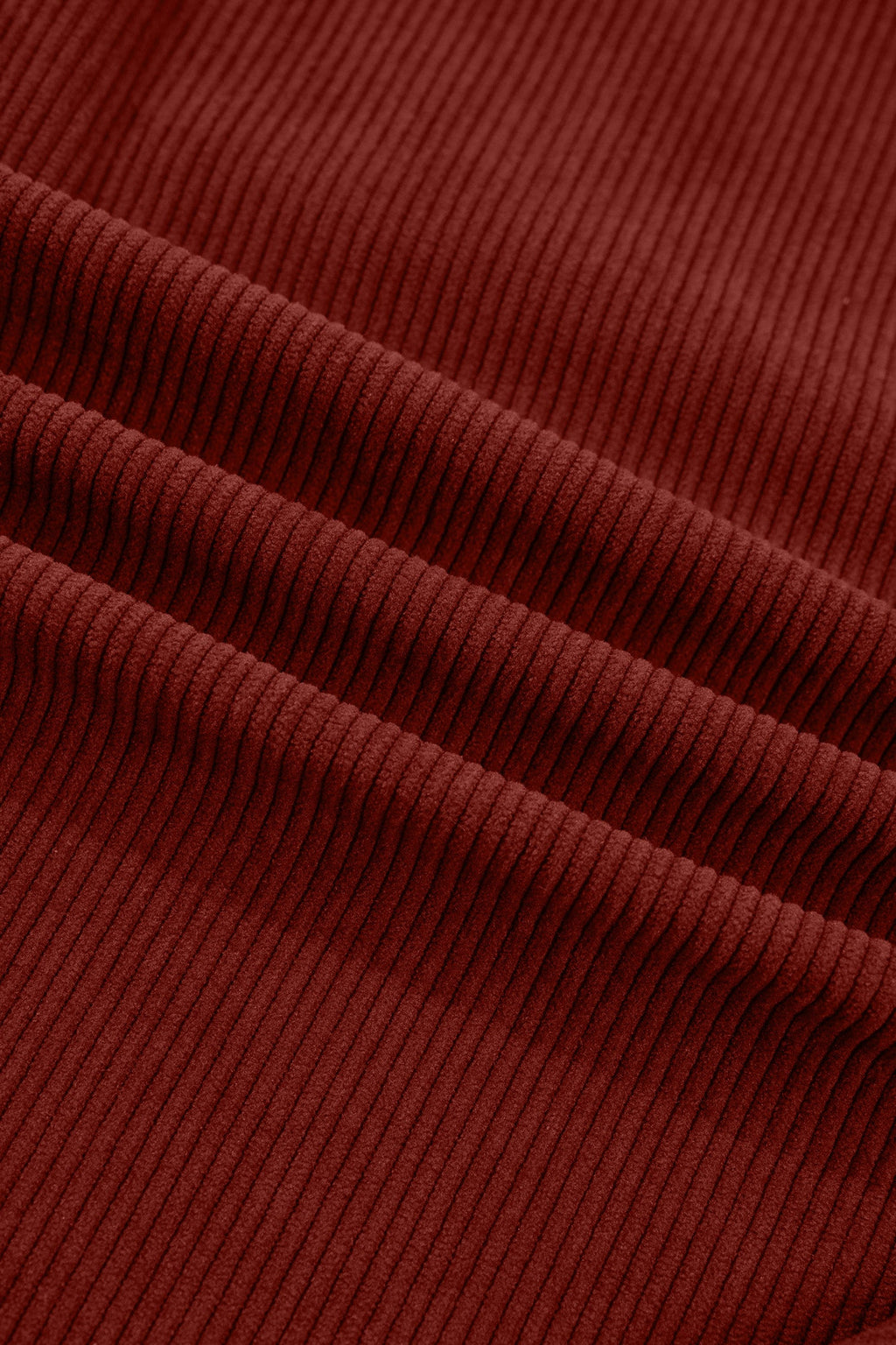 Clay ribbed corduroy fabric texture close-up.