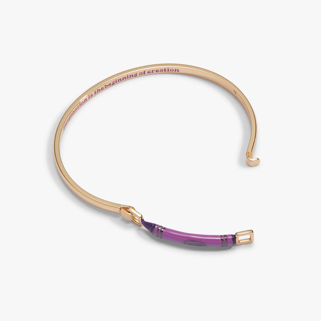 Gold-tone crayon-style tension bangle with purple center stripe and open gap