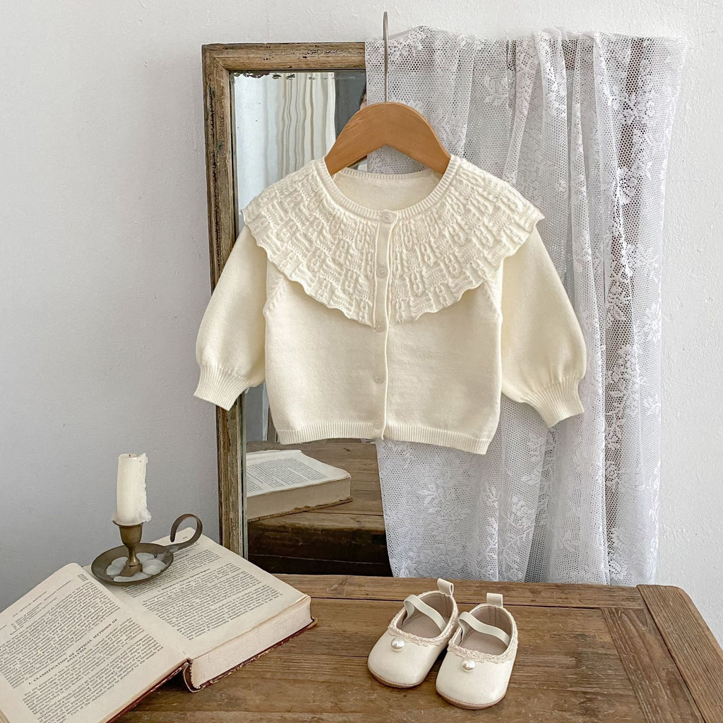 Cream baby knitted cardigan coat with ruffled collar, button placket, long sleeves