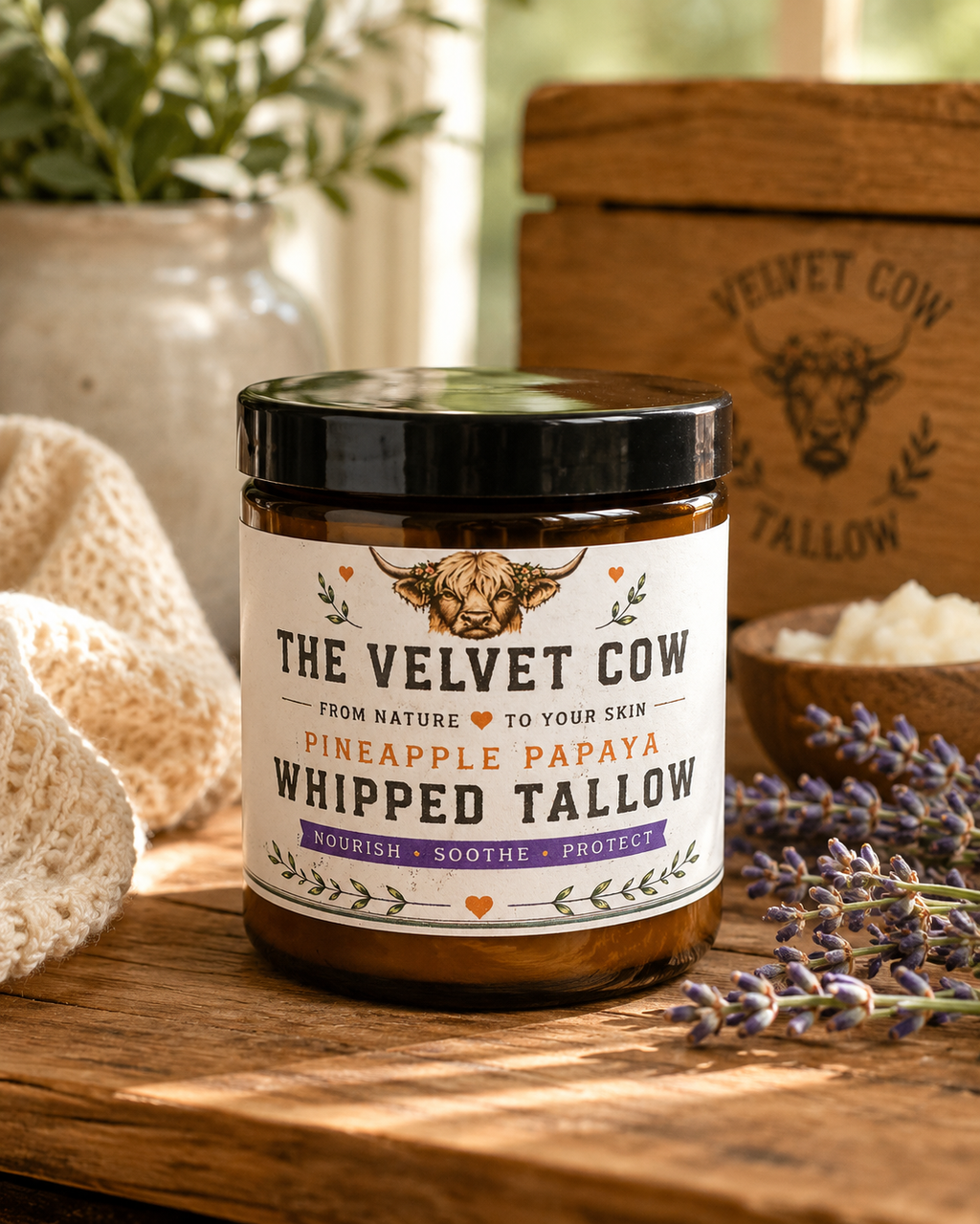 The Velvet Cow whipped tallow body butter jar, black lid, pineapple papaya label