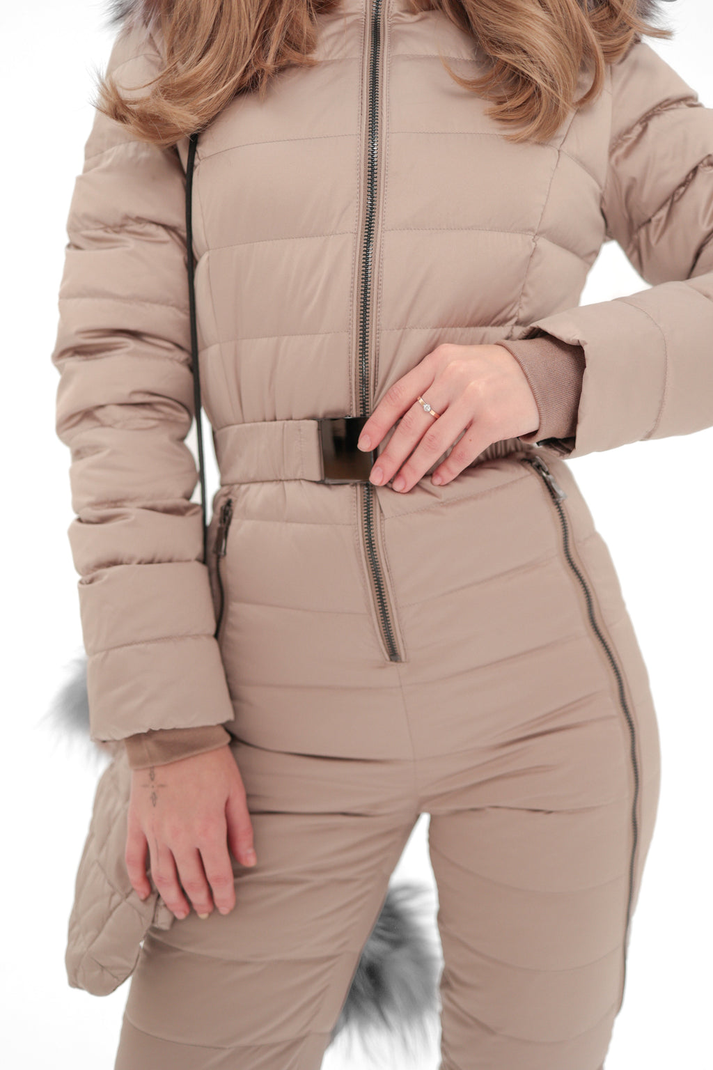 Beige down-insulated snow suit chest detail with full-length zipper and belt.