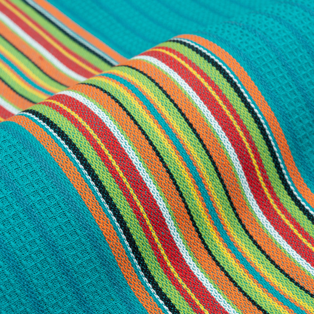 Close-up of teal kitchen towel with multicolor striped weave