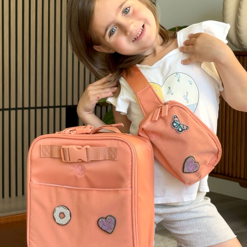 Kids lunch box bag in coral-pink with butterfly and heart patches, side zipper