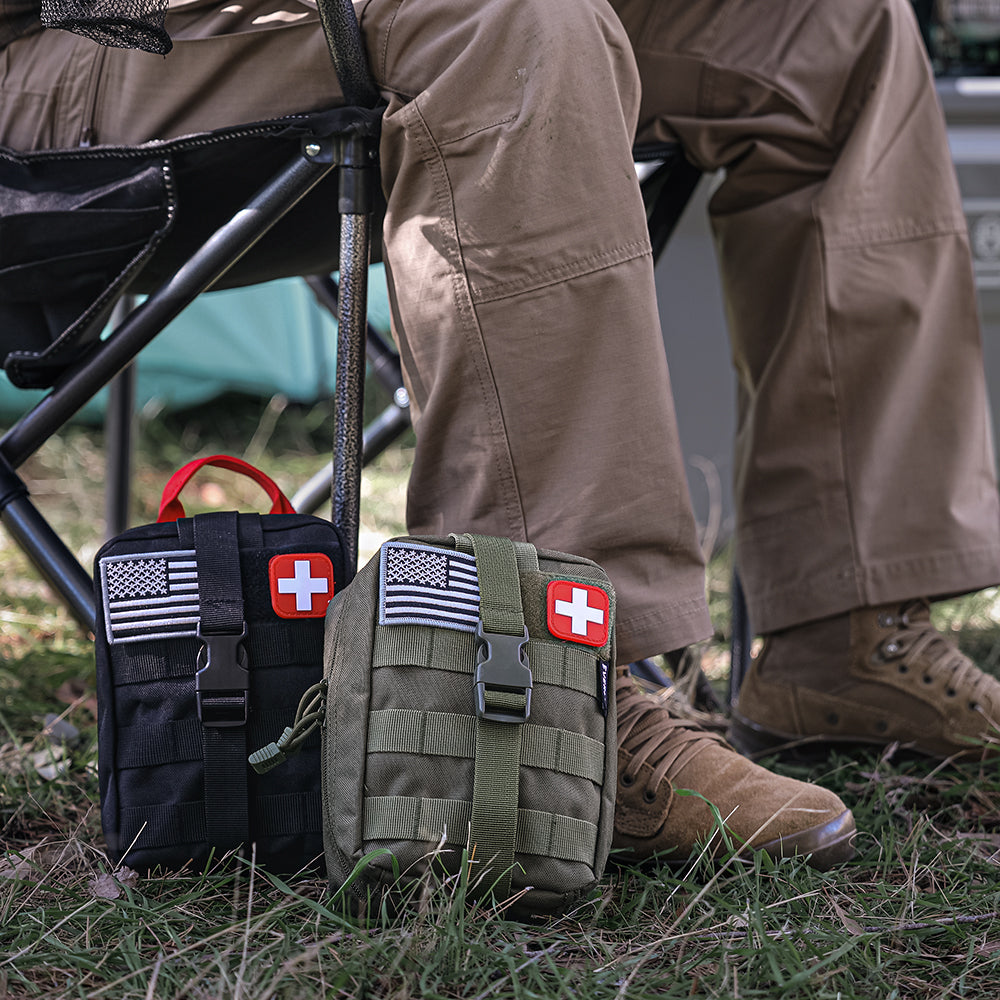 Tactical first aid kit pouches in black and green camo with red cross patches