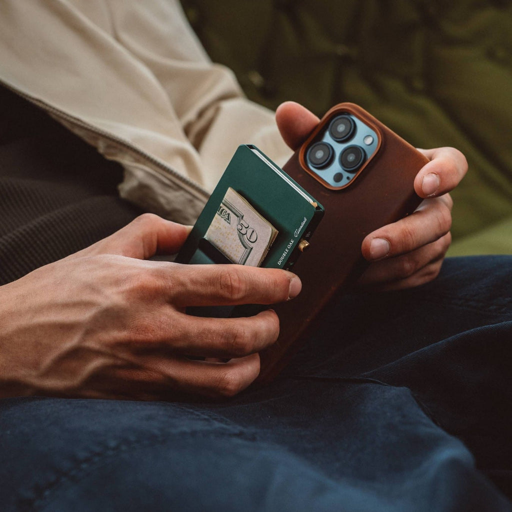 Pop-up cardholder holding a green card insert in a brown-and-teal wallet