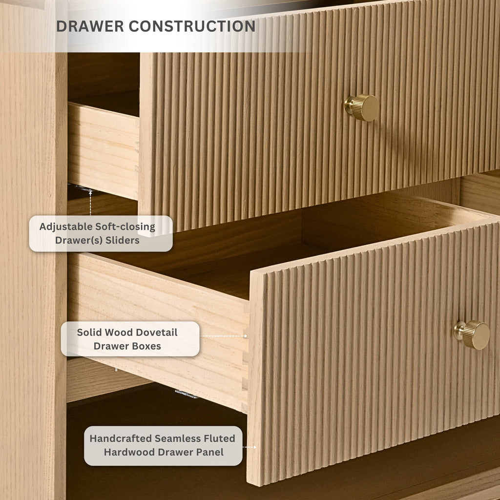 Soft-closing drawer interior with fluted panel styling and gold knobs on oak vanity