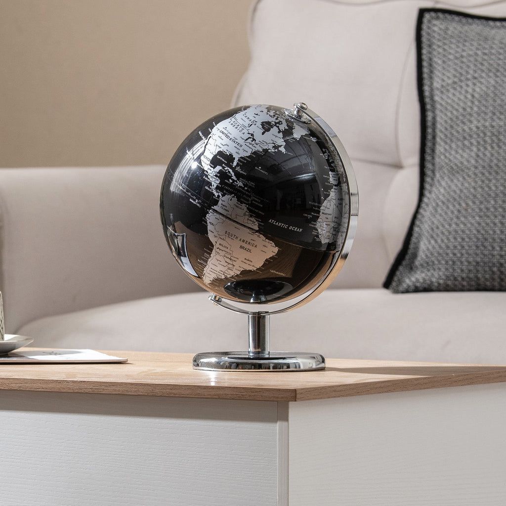 Tabletop decorative earth globe with gold continents and mirrored chrome base.