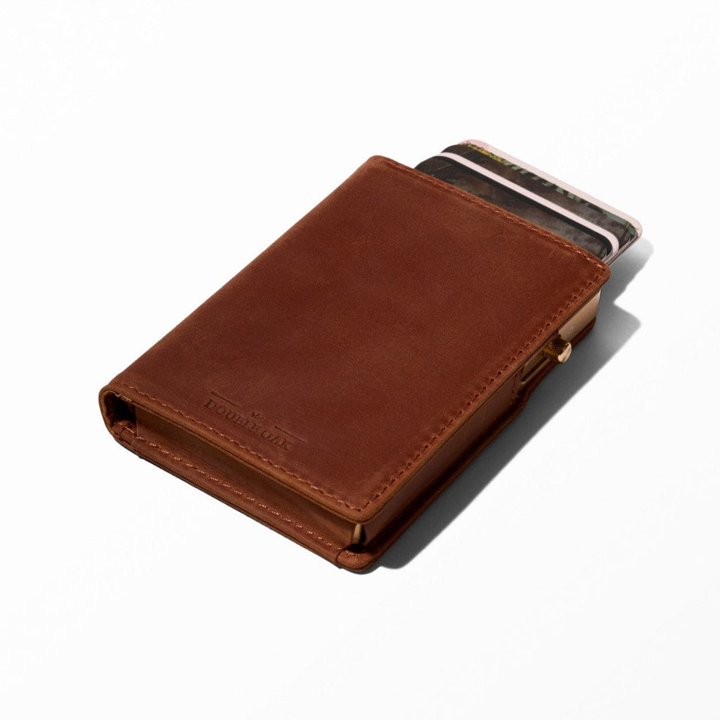 Tan brown bifold leather wallet with snap clasp and card slots visible