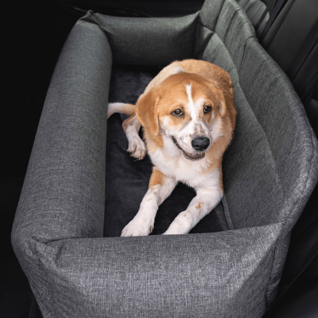 Gray tweed memory foam dog car bed on back seat with cushioned bolsters