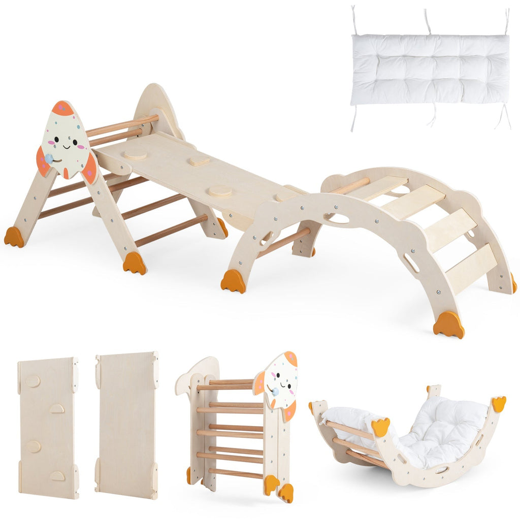 Rocket-themed wooden toddler climbing set with ramp, slide, and white seat cushion, light wood frame.